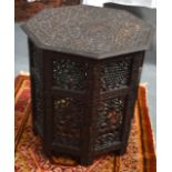 A LATE 19TH/20TH CENTURY ANGLO INDIAN OCTAGONAL HARDWOOD OCCASIONAL TABLE ON STAND with pierced