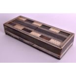 A 19TH CENTURY ANGLO INDIAN IVORY AND HORN RECTANGULAR GAMING BOARD with sliding top and scrolling