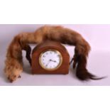 AN EDWARDIAN SMALL MANTEL CLOCK together with a Vintage Ferret neck piece. (2)