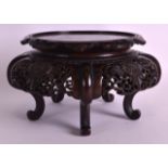 A GOOD LATE 19TH CENTURY JAPANESE PIERCED AND CARVED HARDWOOD STAND decorated with floral motifs.