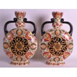 A PAIR OF LATE 19TH CENTURY HUNGARIAN FISCHER ZSOLNAY TWIN HANDLED VASES with reticulated bodies,