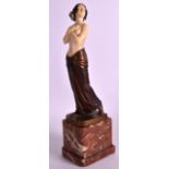 German School (C1920) A cold painted bronze and ivory figure of a nude female, modelled with breasts