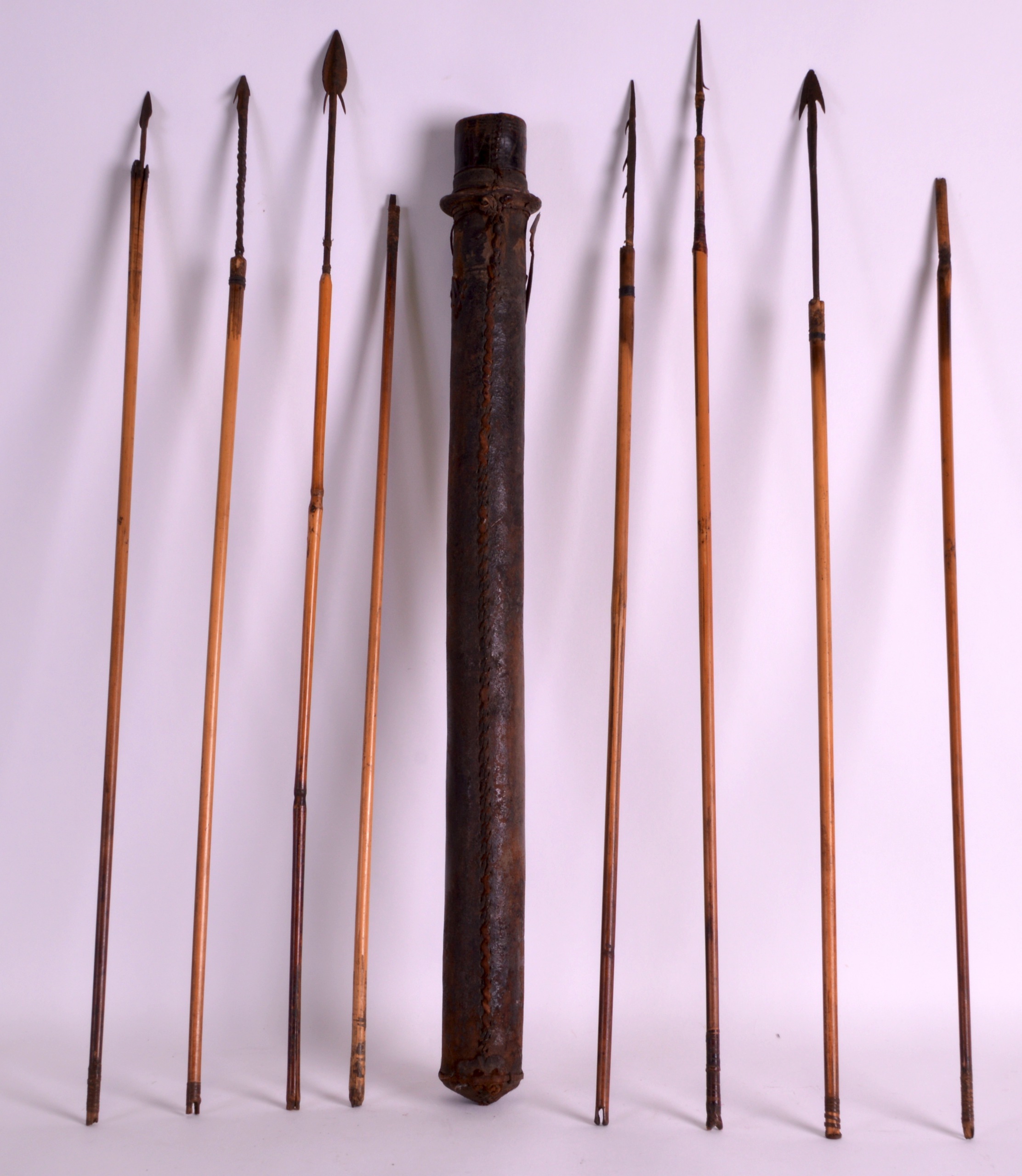 AN UNUSUAL 19TH CENTURY TRIBAL QUIVER CASE containing numerous steel and iron tipped arrows. Case
