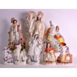 A COLLECTION OF EIGHT STAFFORDSHIRE FIGURES of various sizes. Largest 1ft 8ins high. (8)