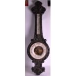 A LARGE EARLY 20TH CENTURY CARVED OAK BAROMETER with enamelled dial. 3Ft 8ins long.