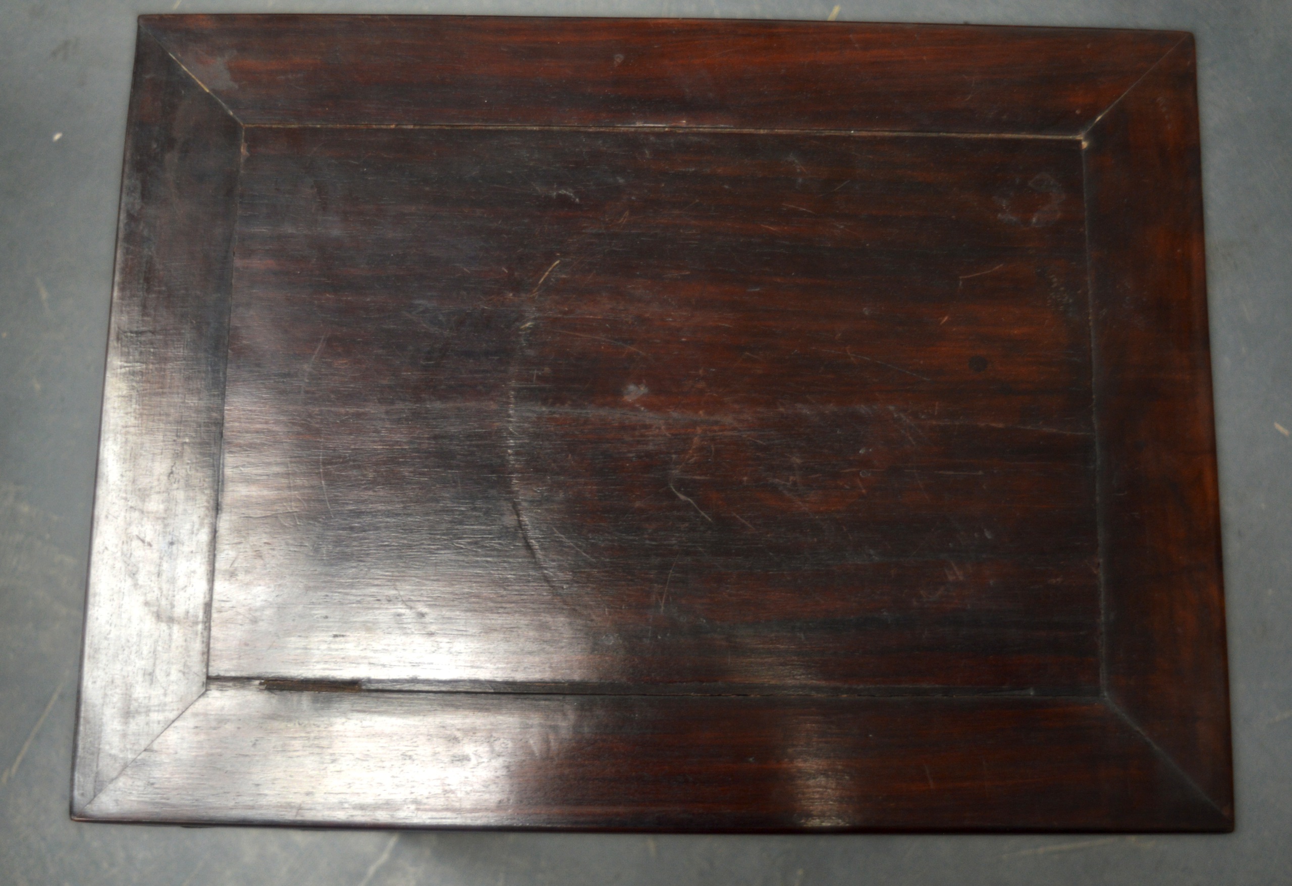 AN EARLY 20TH CENTURY CHINESE CARVED HARDWOOD RECTANGULAR STAND with square legs and floral - Image 2 of 2