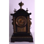 A LATE 19TH CENTURY FRENCH MARBLE AND BRONZE MANTEL CLOCK with dragon handles, the front inset