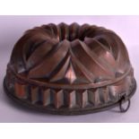 A VICTORIAN COPPER JELLY MOULD. 9.5ins diameter.