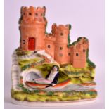 AN UNUSUAL STAFFORDSHIRE PRINCE OF WALES FIGURE modelled below Windsor Castle. 7.5ins high.