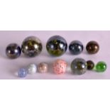 A GROUP OF TWELVE VINTAGE MICA MARBLES of various forms and sizes. Largest 1.25ins diameter. (12)