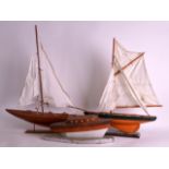 A VINTAGE CARVED WOOD YACHT together with two other similar models. (3)