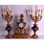 A LATE 19TH CENTURY FRENCH BLUE PORCELAIN AND GILT METAL CLOCK GARNITURE the dial signed Mon Vernet,