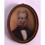 AN EARLY 19TH CENTURY PAINTED PORTRAIT IVORY MINIATURE depicting a male wearing a black bow tie. 2.