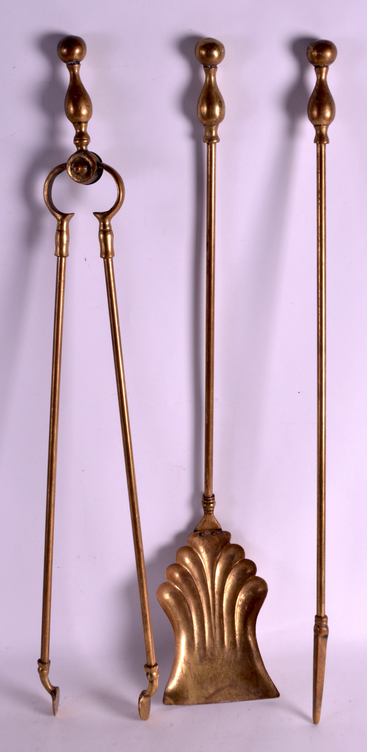 A SET OF THREE ANTIQUE FIRESIDE TOOLS.