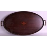 AN EDWARDIAN TWIN HANDLED MAHOGANY TRAY inset with an urn. 2Ft 1ins wide.