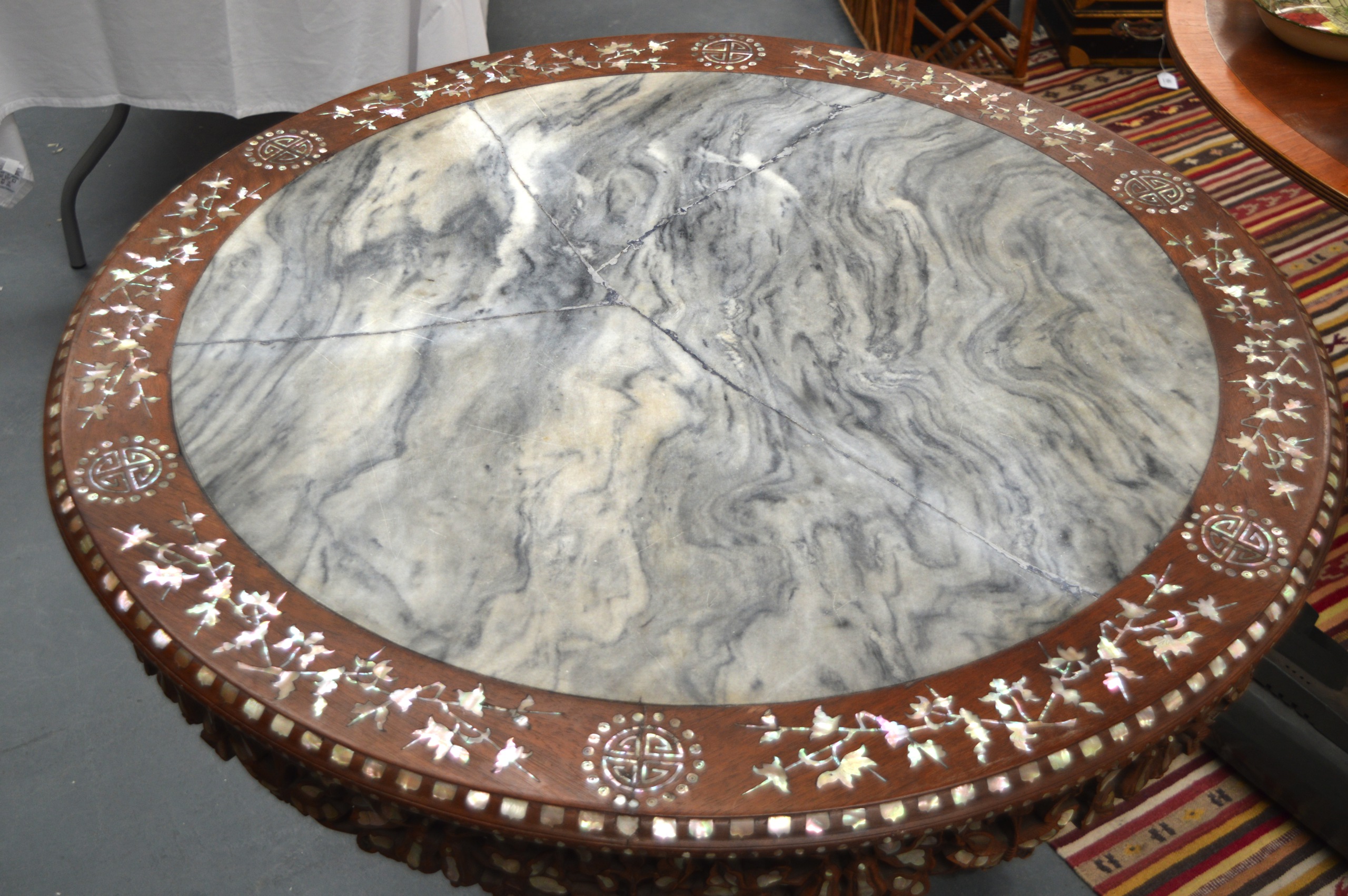 A GOOD 19TH CENTURY CHINESE CARVED HARDWOOD AND MOTHER OF PEARL CENTRE TABLE supported on boldly - Image 2 of 3