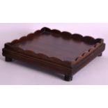 A LATE 19TH CENTURY JAPANESE CARVED HARDWOOD STAND of square form. 8.25ins wide.