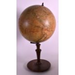 A VINTAGE COLUMBUS ERDGLOBUS REVOLVING DESK GLOBE upon a turned wood base. 1Ft 6ins high.