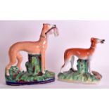 A STAFFORDSHIRE FIGURE OF A HOUND together with another similar model of a hound. 9.5ins & 7.5ins