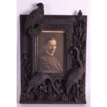 AN UNUSUAL 19TH CENTURY EUROPEAN CARVED WOOD PHOTOGRAPH FRAME modelled as three birds amongst