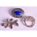 A STYLISH ARTS AND CRAFTS SILVER AND LAPIS LAZULI BROOCH together with two other silver brooches. (