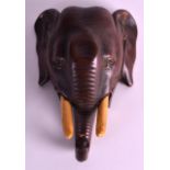 A LATE VICTORIAN NOVELTY TABLE BELL in the form of an elephant, with tusks. 6Ins wide.