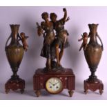 AN ART NOUVEAU FRENCH THREE PIECE SPELTER CLOCK GARNITURE the mantel formed as a standing couple