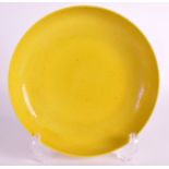 A CHINESE YELLOW GLAZED CIRCULAR SAUCER DISH 20th Century, bearing Yongzheng marks to base,