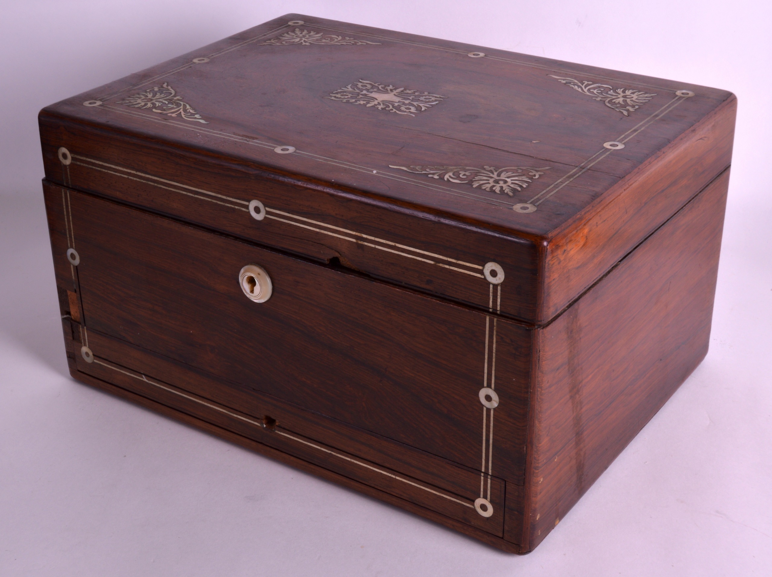 A VICTORIAN ROSEWOOD TRAVELLING VANITY BOX the top rising to reveal a fitted interior with silver