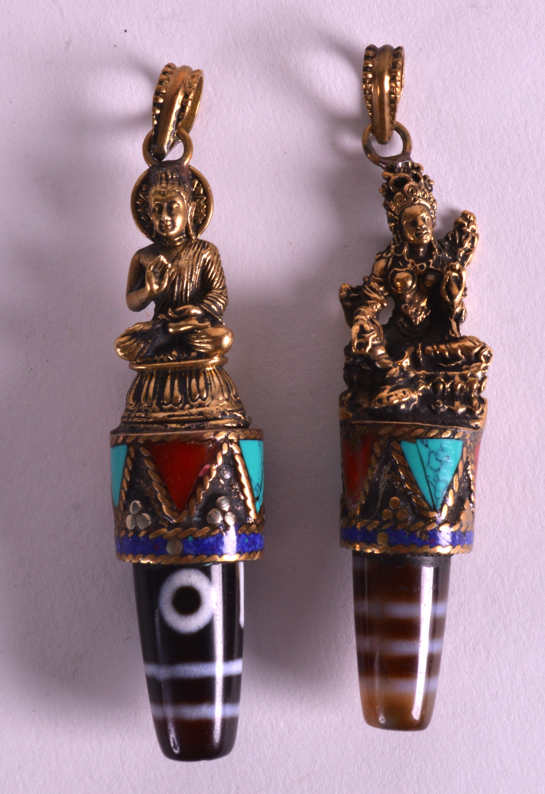 AN UNUSUAL PAIR OF LATE 19TH/20TH CENTURY GILT BUDDHAS with unusual hardstone inset panels and