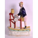 A RARE STAFFORDSHIRE FIGURE OF A KNIFE GRINDER modelled upon an oval base. 11Ins high.