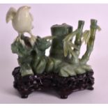 AN EARLY 20TH CENTURY CHINESE CARVED HARDSTONE FIGURAL GROUP depicting a bird perched upon a rocky