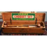 A VINTAGE BOXED JACQUES CROQUET SET.