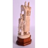 A LATE 19TH/20TH CENTURY INDIAN CARVED IVORY FIGURE OF AN ELEPHANT modelled with an attendant. Ivory