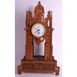 AN EARLY 20TH CENTURY FRENCH CARVED WOOD CLOCK of pierced architectural form, the dial signed