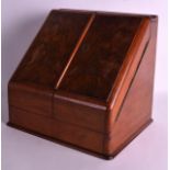 AN EDWARDIAN WALNUT VENEERED DESK STATIONARY CABINET the doors opening to reveal a fitted