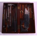 A CASED EDWARDIAN WORKMANS TOOL SET.