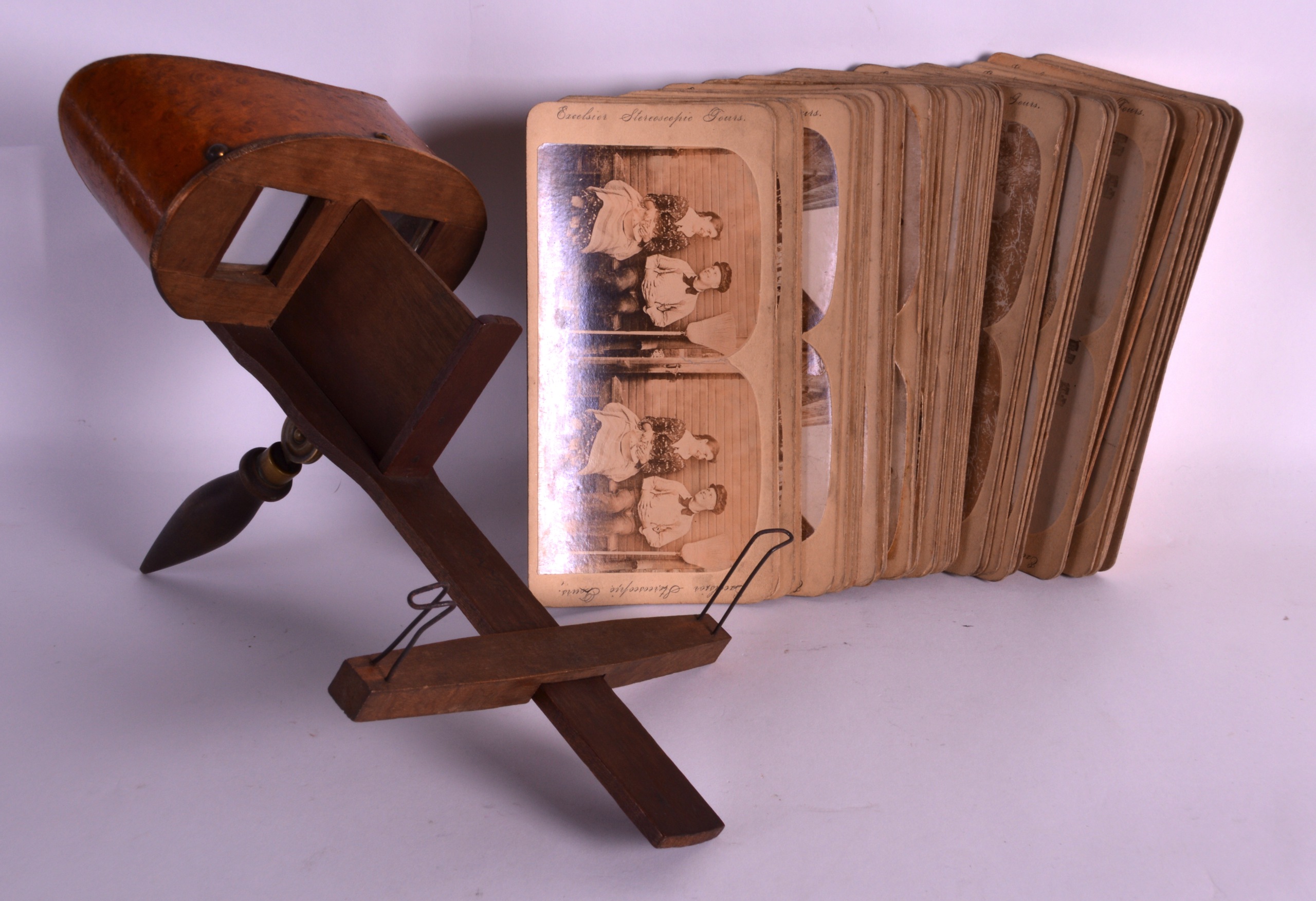 AN EDWARDIAN WALNUT VENEERED VIEWER together with various photographs. (qty)