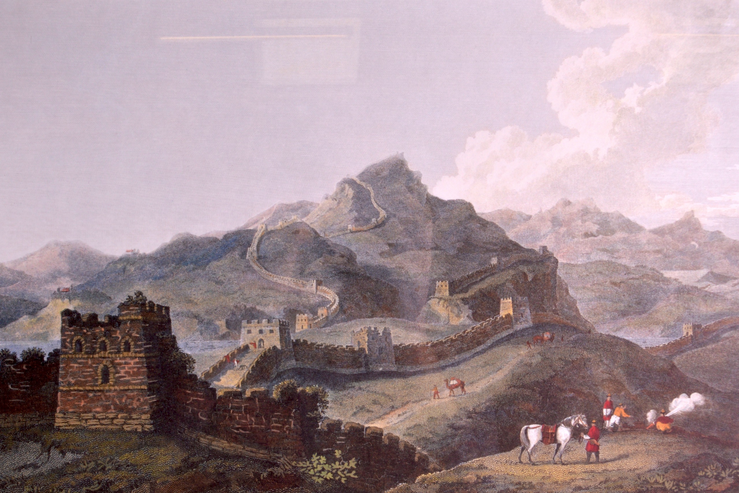 AN INTERESTING PAIR OF FRAMED PRINTS depicting the Great Wall of China, the other showing the