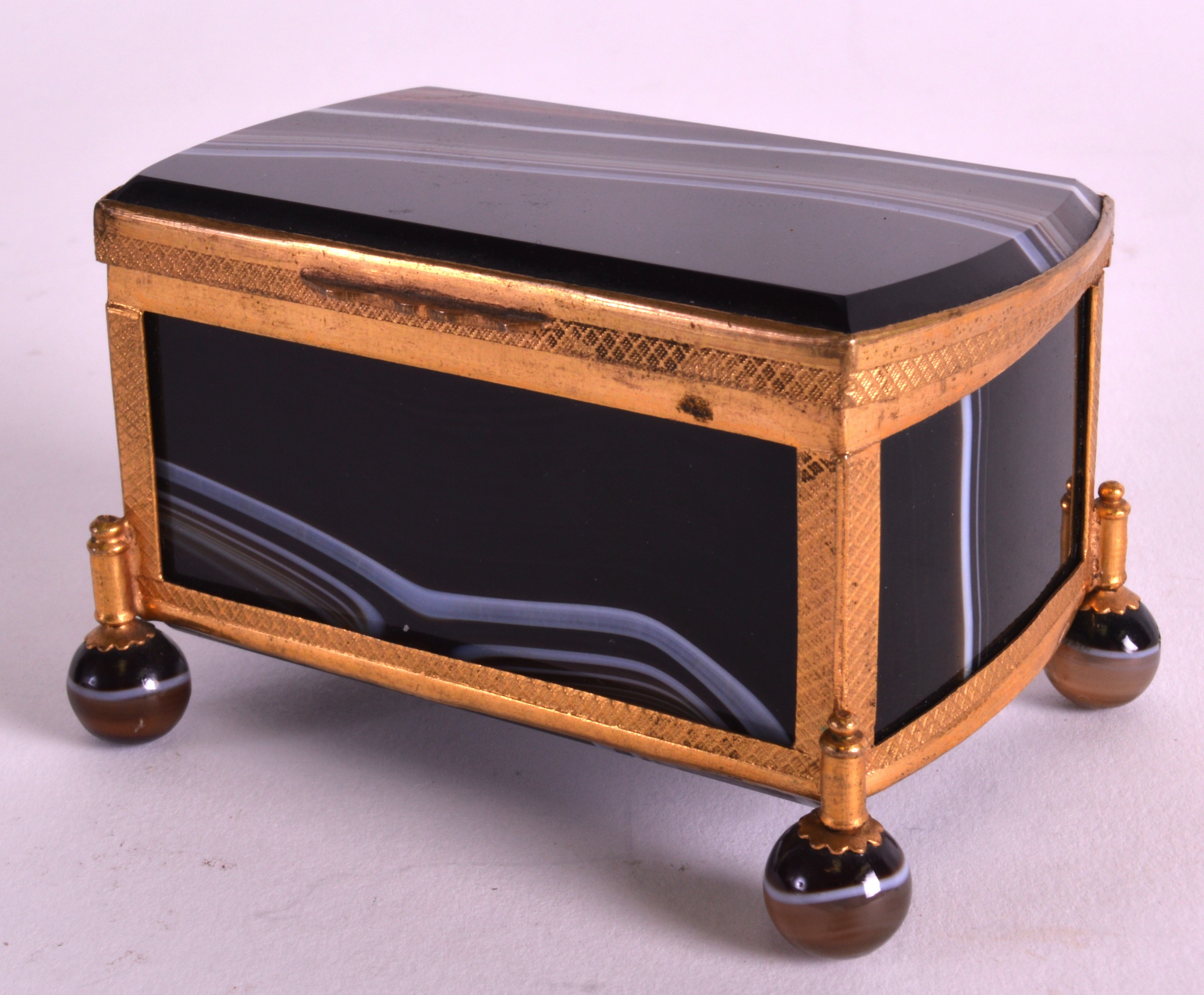 A LATE 19TH CENTURY FRENCH CARVED RECTANGUALR AGATE CASKET with gilt metal mounts. 3Ins wide.