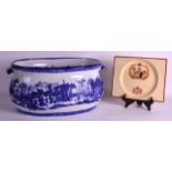 A LARGE STAFFORDSHIRE TYPE BLUE AND WHITE FOOT BATH decorated with classical scenes, together with