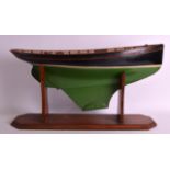 A LARGE EARLY 20TH CENTURY PAINTED AND LACQUERED WOOD BOAT named 'Vera' supported upon an oak