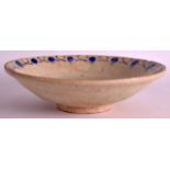 A 12TH/13TH CENTURY PERSIAN BOWL painted with a sparse blue border.