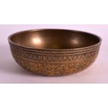 A SMALL 18TH/19TH CENTURY PERSIAN ENGRAVED BRONZE BOWL decorated with figures. 3.75ins diameter.