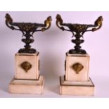 A PAIR OF 19TH CENTURY FRENCH BRONZE AND MARBLE URNS upon square stands. 1Ft 3ins high.