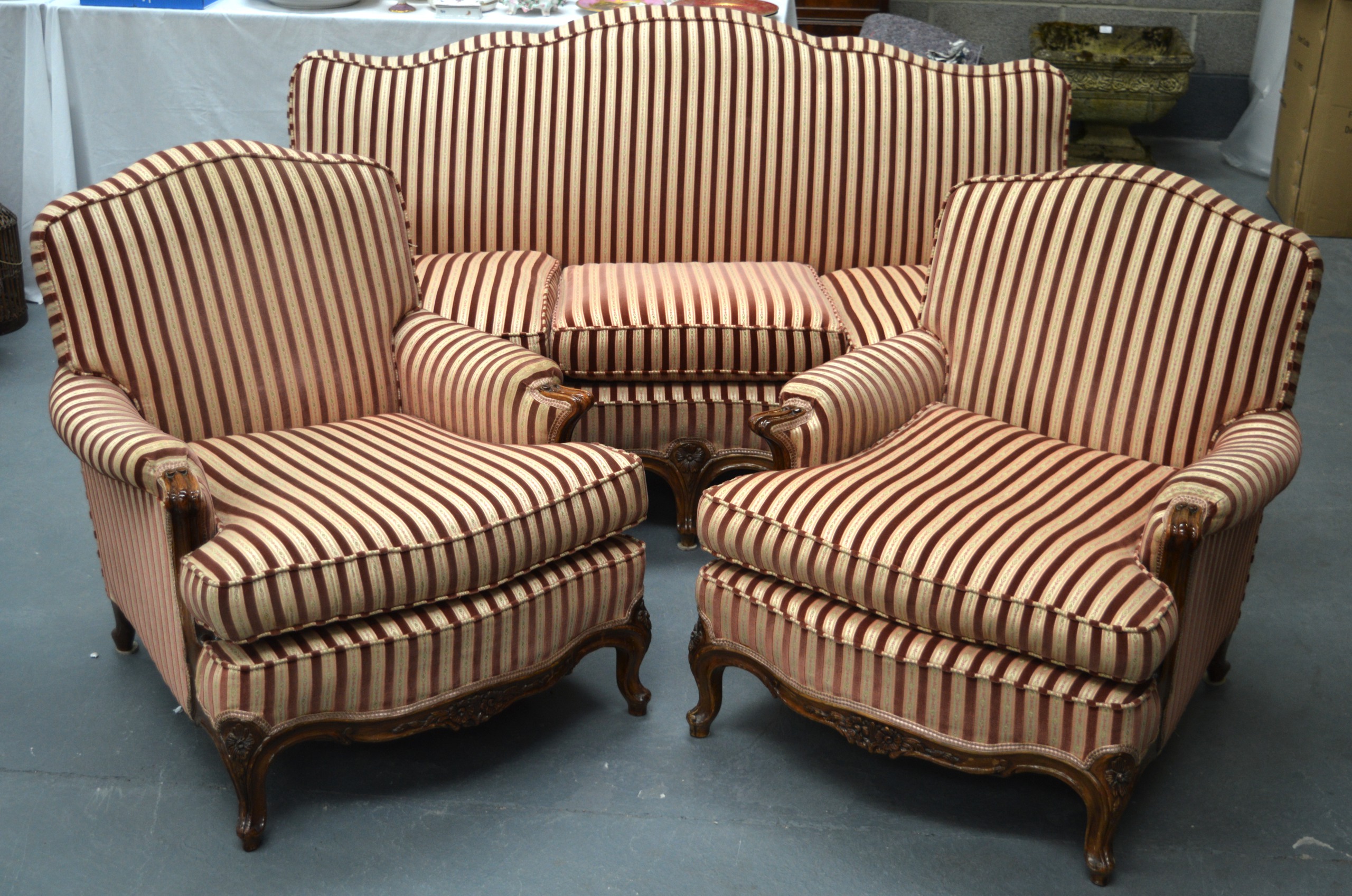 A VICTORIAN UPHOLSTERED THREE PIECE SALON SUITE comprising of settee and pair of matching walnut