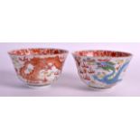 A PAIR OF EARLY 20TH CENTURY CHINESE FAMILLE ROSE BOWLS painted with dragons amongst clouds. 4Ins
