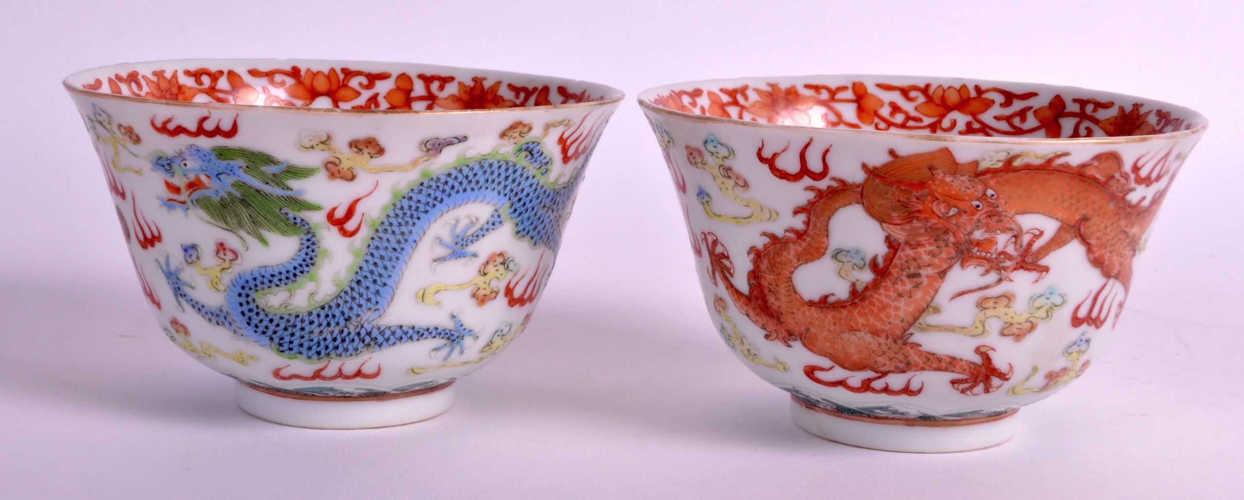 A PAIR OF EARLY 20TH CENTURY CHINESE FAMILLE ROSE BOWLS painted with dragons amongst clouds. 4Ins - Image 2 of 3