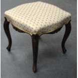 A VICTORIAN UPHOLSTERED STOOL. 1Ft 5ins wide.