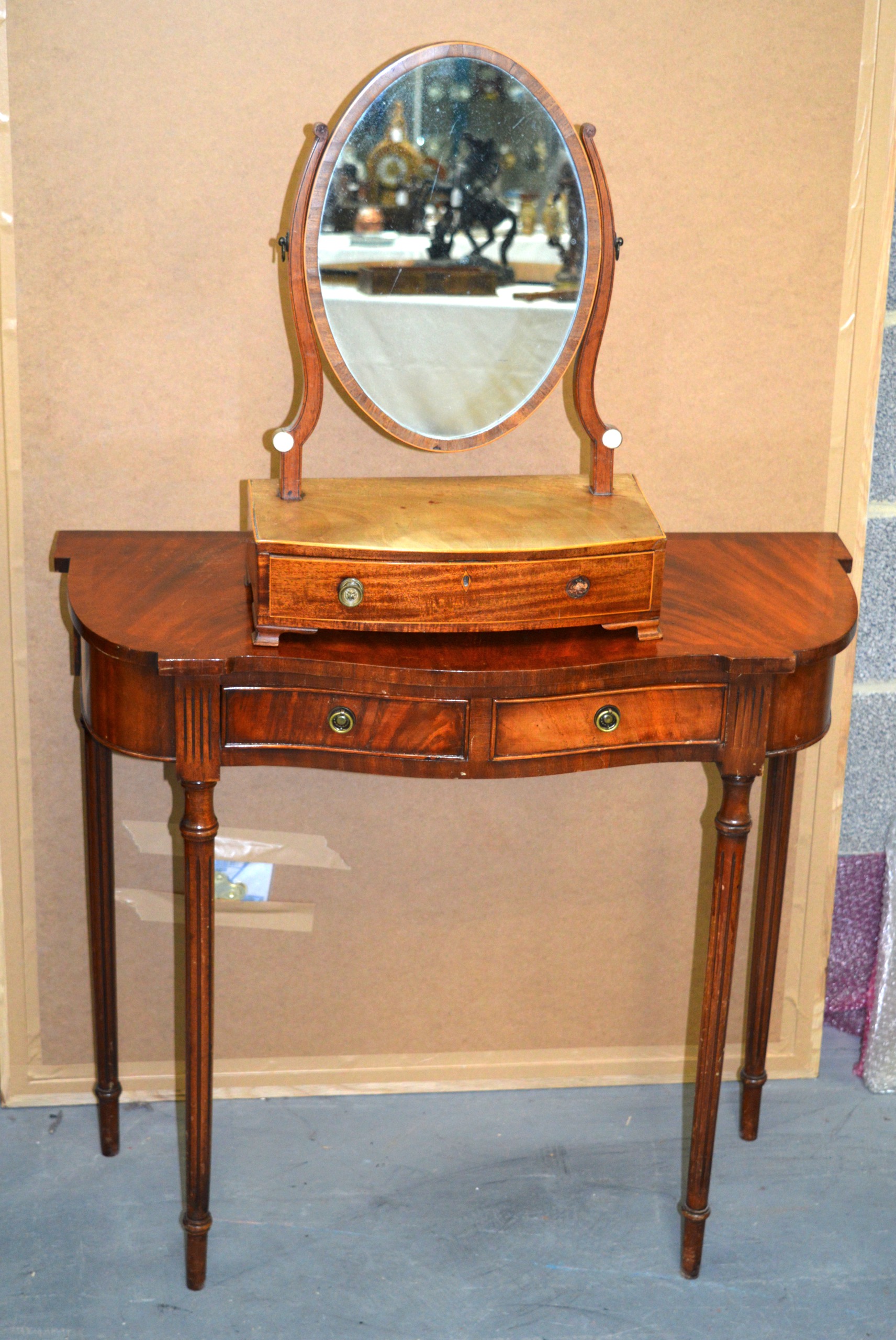 A DRESSING TABLE together with an oval mirror. (2)